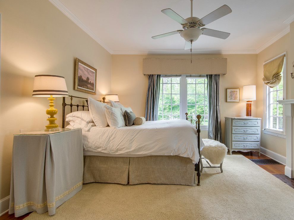 Design ideas for a traditional bedroom in Charlotte with beige walls.