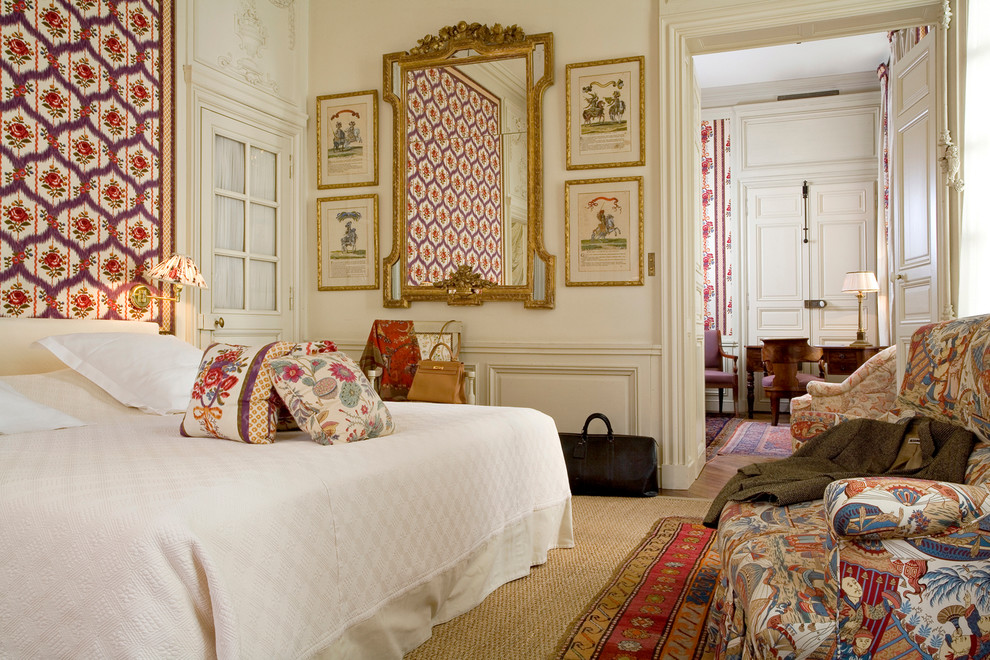 Bedroom - traditional medium tone wood floor bedroom idea in Charleston with beige walls