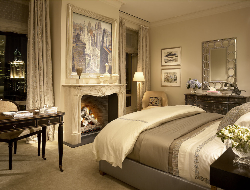 Inspiration for a timeless carpeted bedroom remodel in Other with beige walls and a standard fireplace