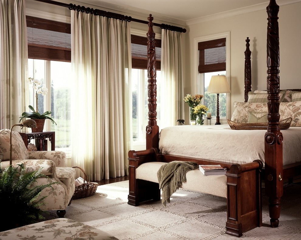 Elegant bedroom photo in Miami with beige walls