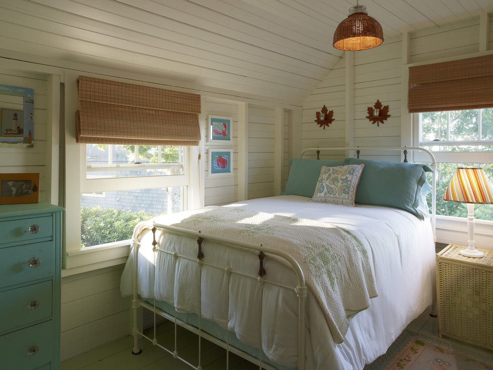 Inspiration for a rustic bedroom with white walls.