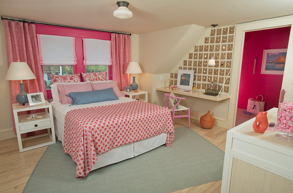 Design ideas for a traditional grey and pink bedroom in DC Metro with pink walls, light hardwood flooring and a feature wall.