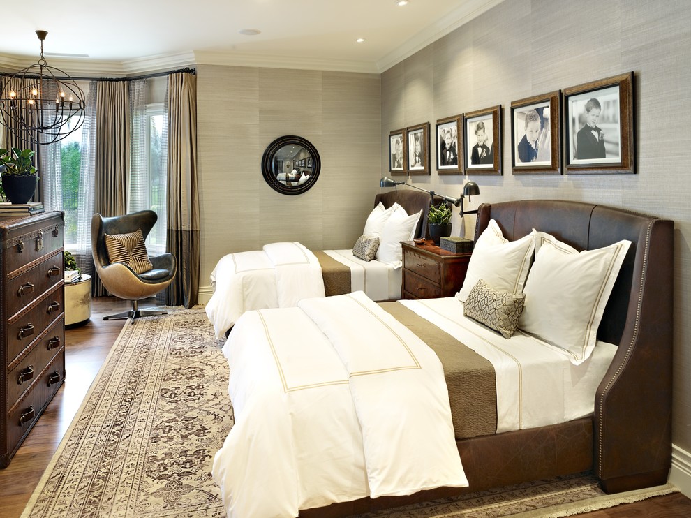 Elegant medium tone wood floor bedroom photo in Las Vegas with gray walls