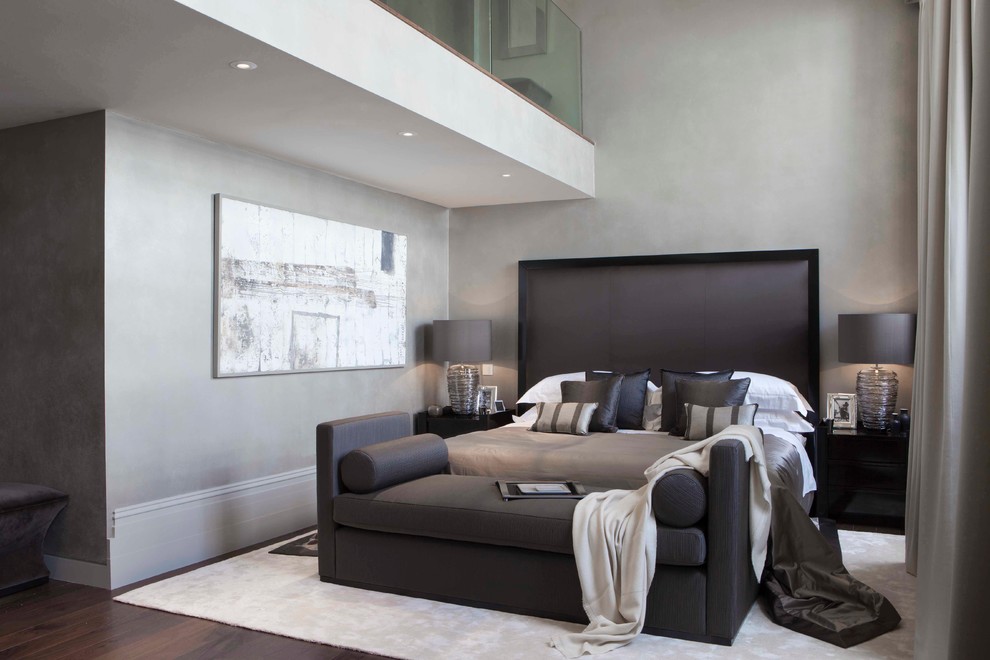Traditional grey and brown bedroom in Other with grey walls.