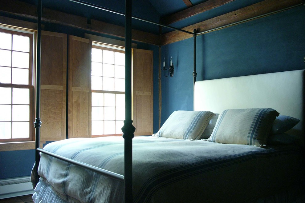 This is an example of a medium sized classic master bedroom in Bridgeport with blue walls and dark hardwood flooring.