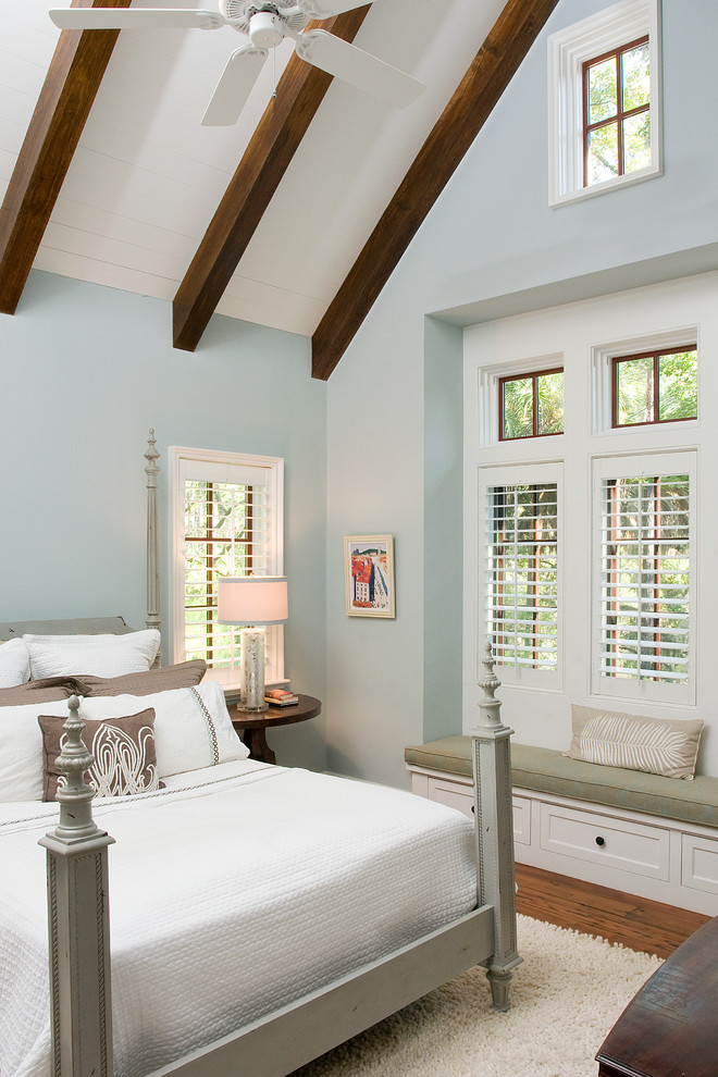 Traditional grey and brown bedroom in Atlanta with blue walls.