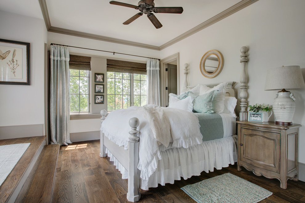 Inspiration for a timeless guest dark wood floor and brown floor bedroom remodel in Other with white walls and no fireplace