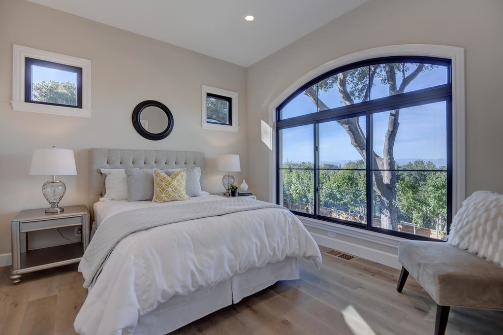 Inspiration for a large transitional guest light wood floor and beige floor bedroom remodel in San Francisco with beige walls