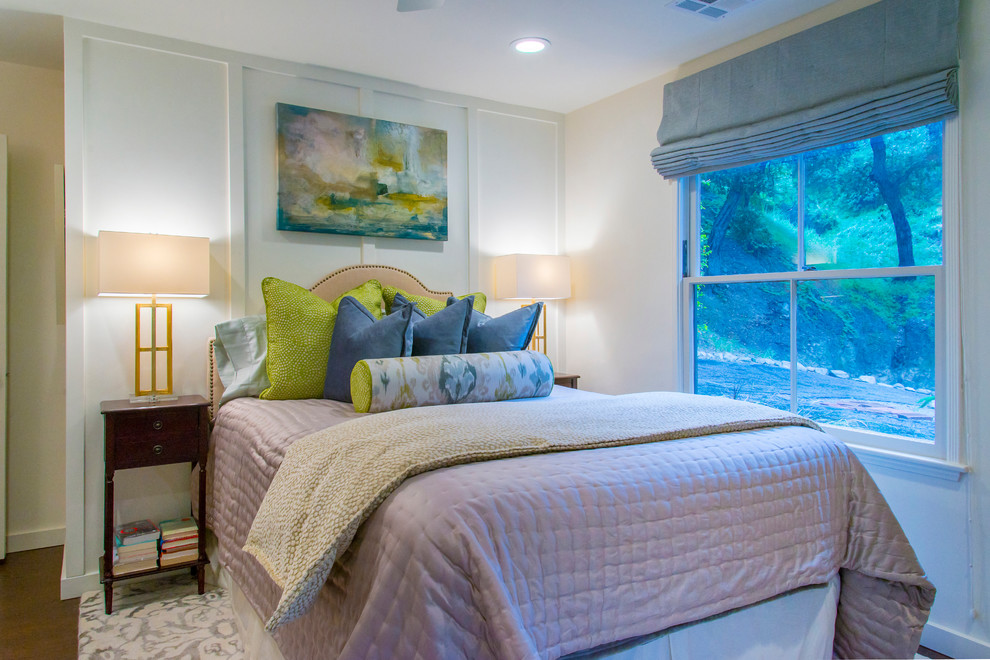Example of a transitional guest medium tone wood floor bedroom design in Los Angeles with white walls