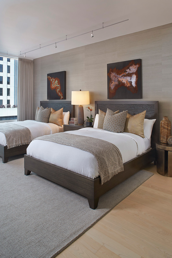 Design ideas for a traditional bedroom in San Francisco with beige walls and light hardwood flooring.