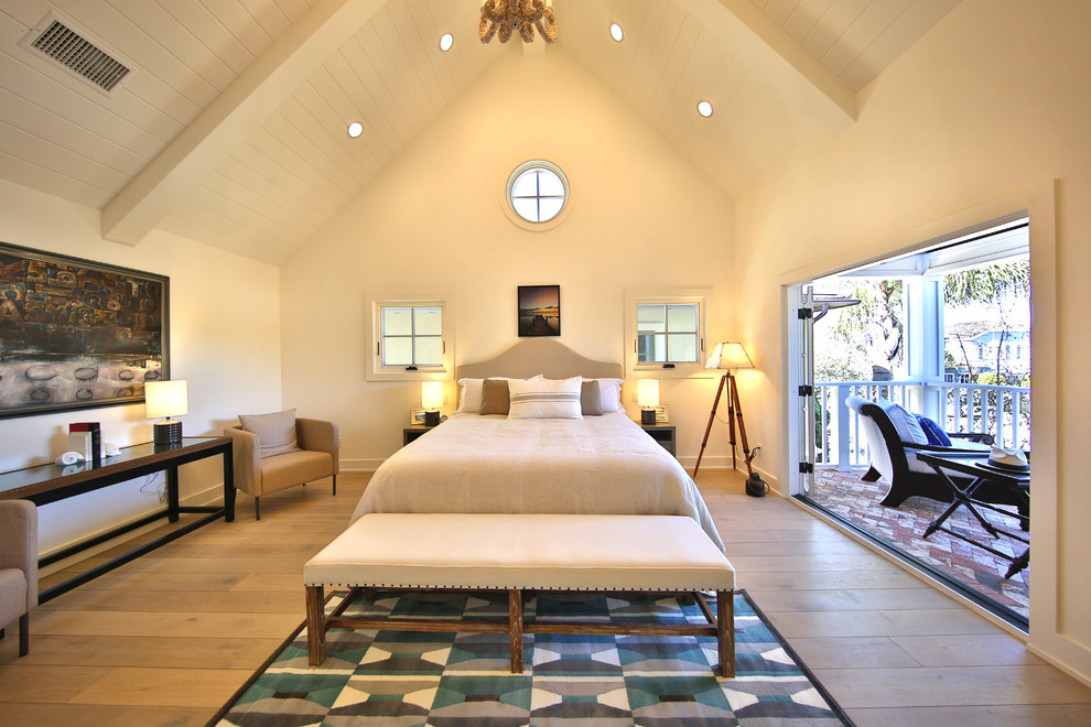 Transitional medium tone wood floor bedroom photo in Orange County with white walls and no fireplace