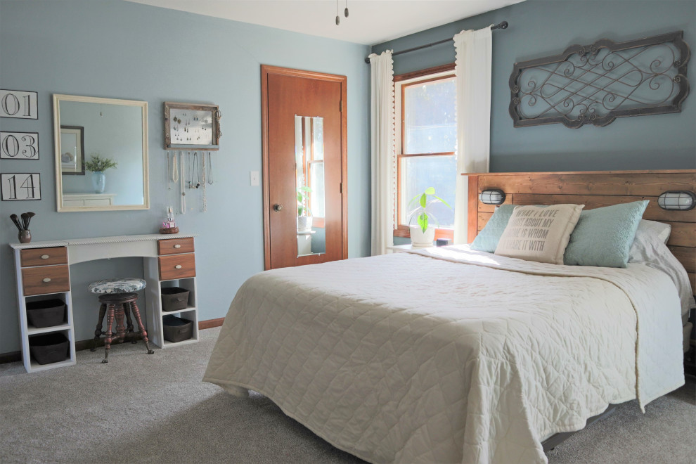 This is an example of a small classic master bedroom in Other with blue walls, carpet and grey floors.