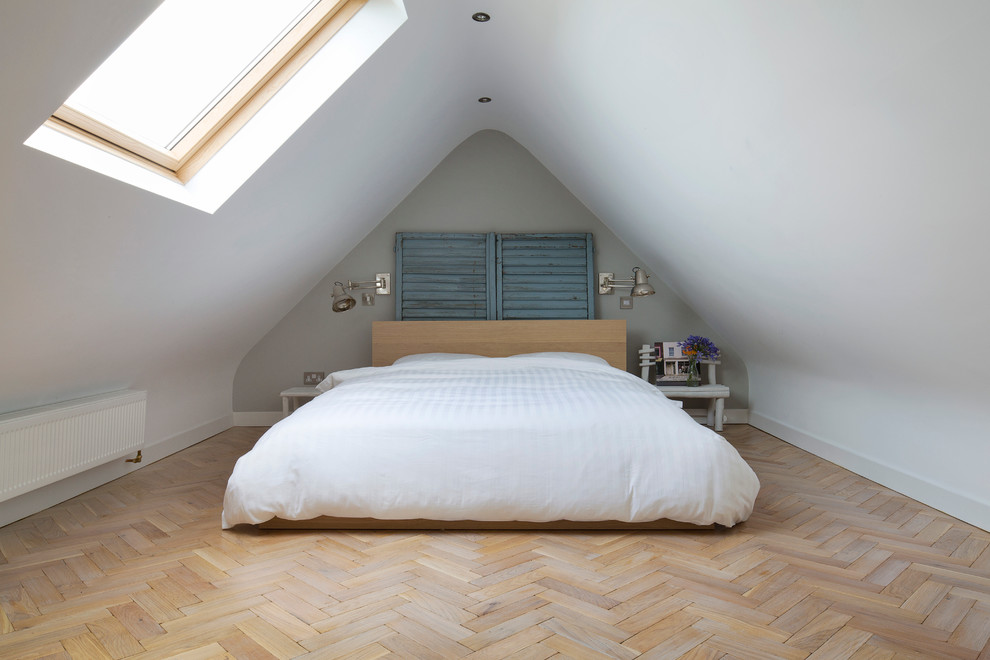 Bedroom - mid-sized transitional medium tone wood floor bedroom idea in Other with white walls and no fireplace