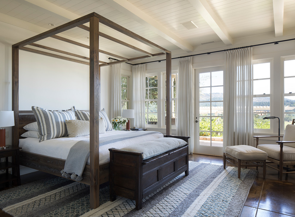 Example of a transitional master brown floor bedroom design in San Francisco with white walls