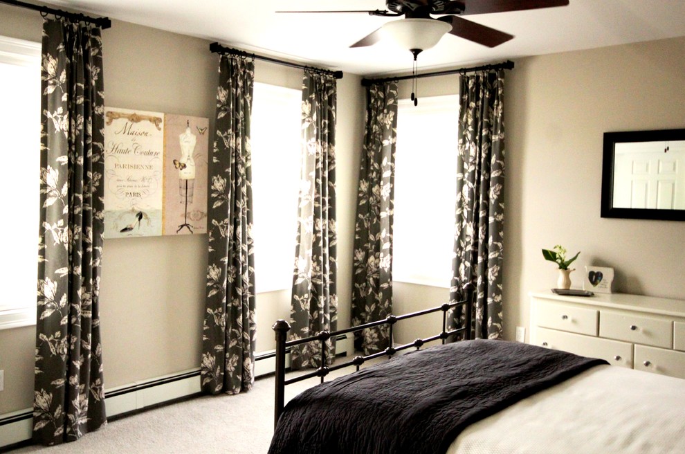 Example of a transitional bedroom design in Portland Maine
