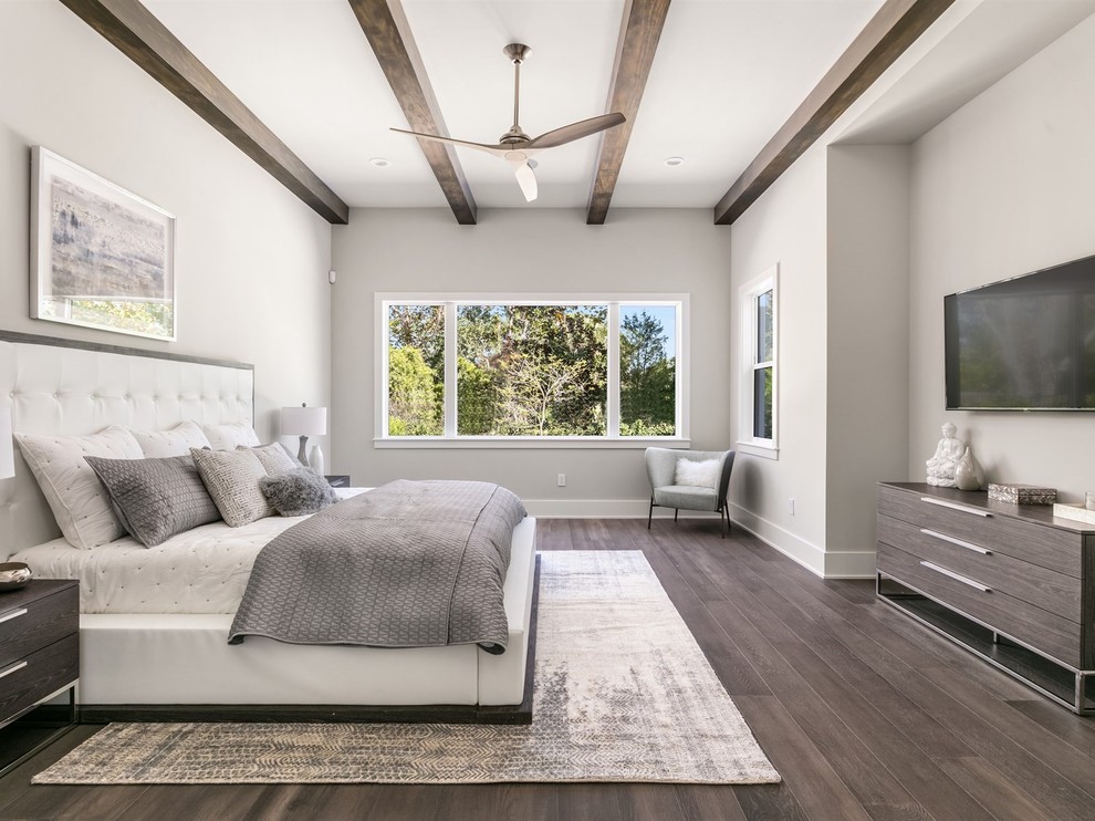 Large transitional master dark wood floor and brown floor bedroom photo in Orlando with gray walls and no fireplace
