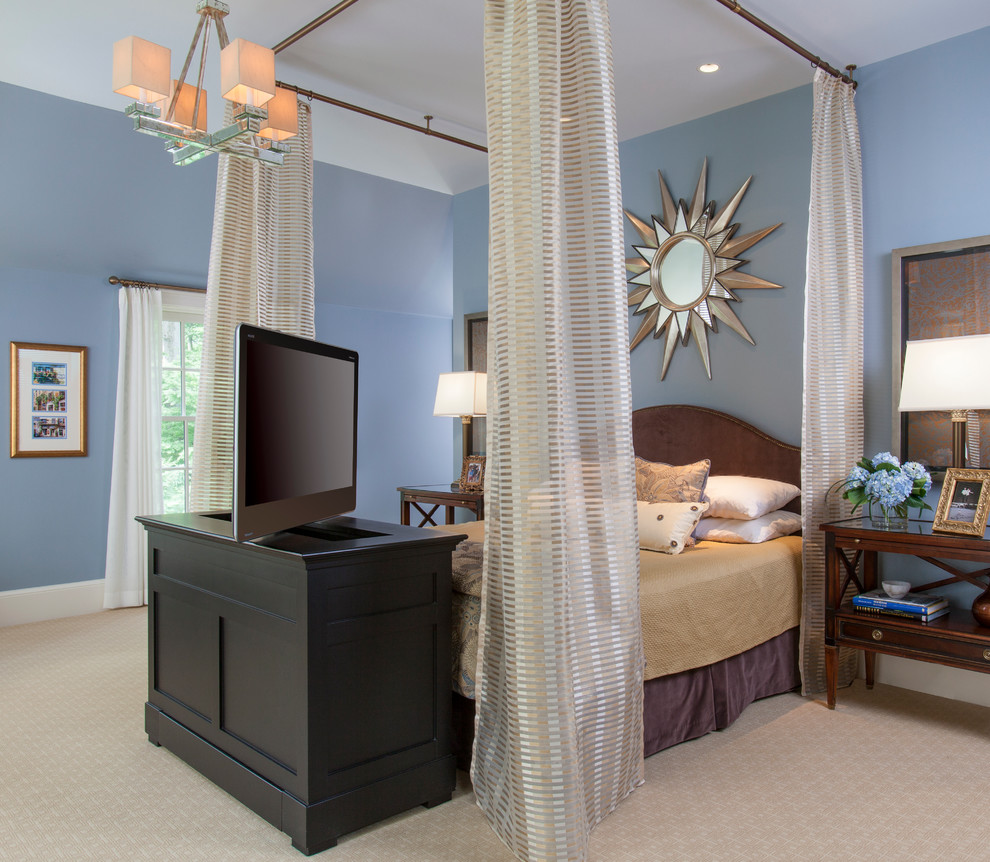 Example of a huge transitional master carpeted bedroom design in DC Metro with blue walls