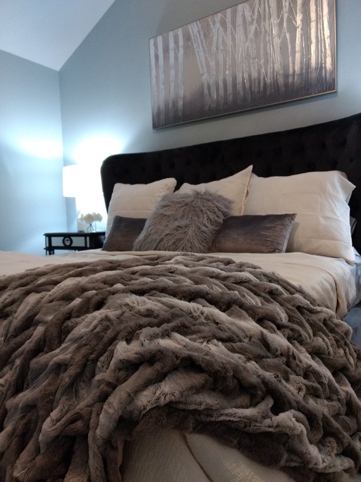 Inspiration for a large classic master, grey and cream and grey and silver bedroom in Houston with blue walls, dark hardwood flooring, no fireplace and brown floors.