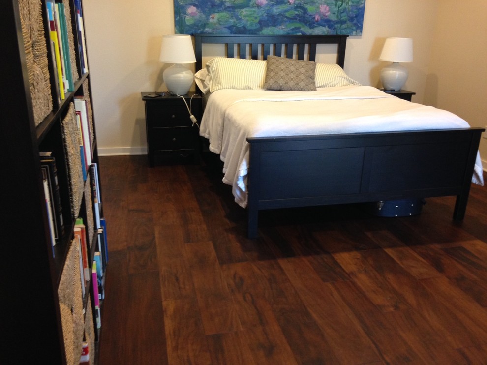 Inspiration for a mid-sized rustic master medium tone wood floor bedroom remodel in Austin with beige walls