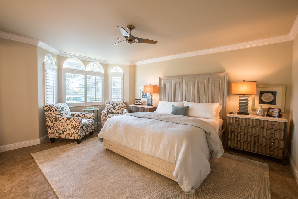 Example of a large classic master bedroom design in Miami with beige walls