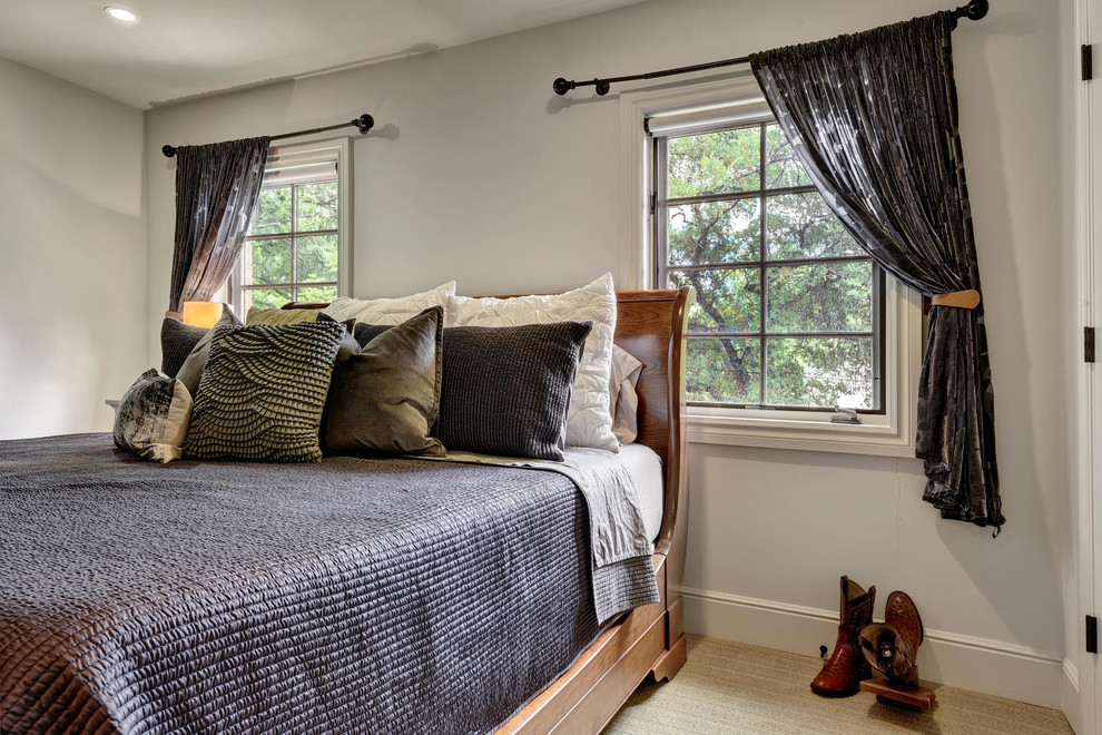 Example of a transitional bedroom design in Austin