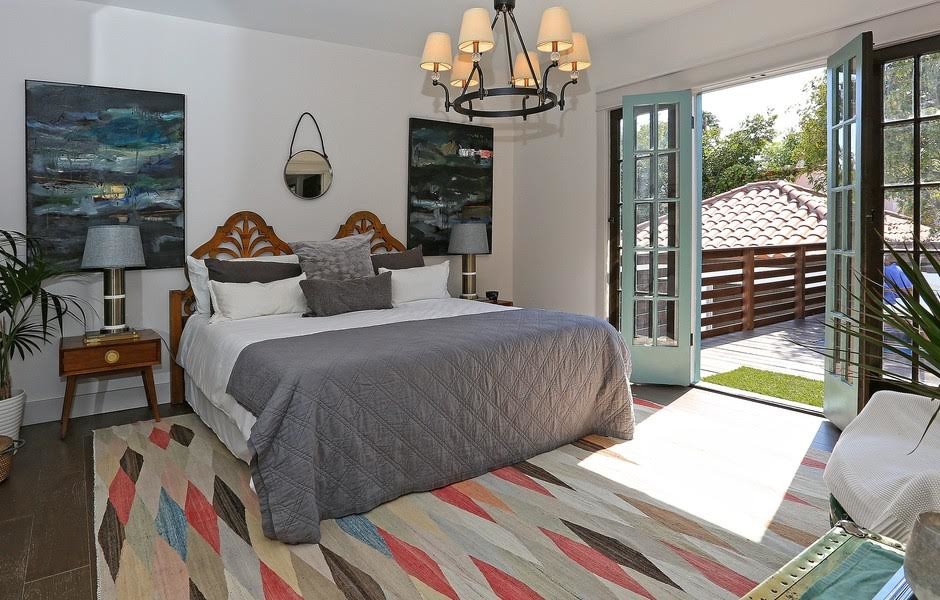 Example of a large transitional master ceramic tile bedroom design in Los Angeles with white walls