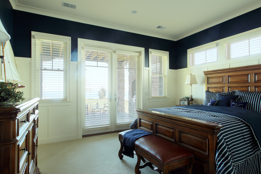 Large elegant master carpeted bedroom photo in Grand Rapids with blue walls