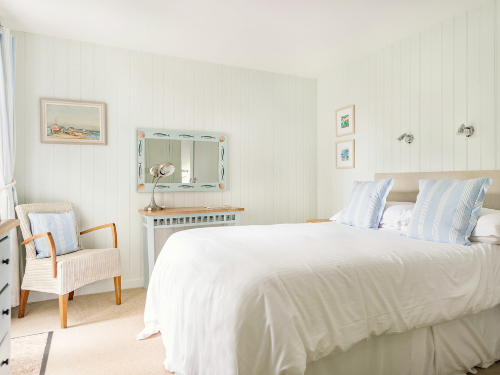 Bedroom - small coastal carpeted and beige floor bedroom idea in Cornwall with green walls