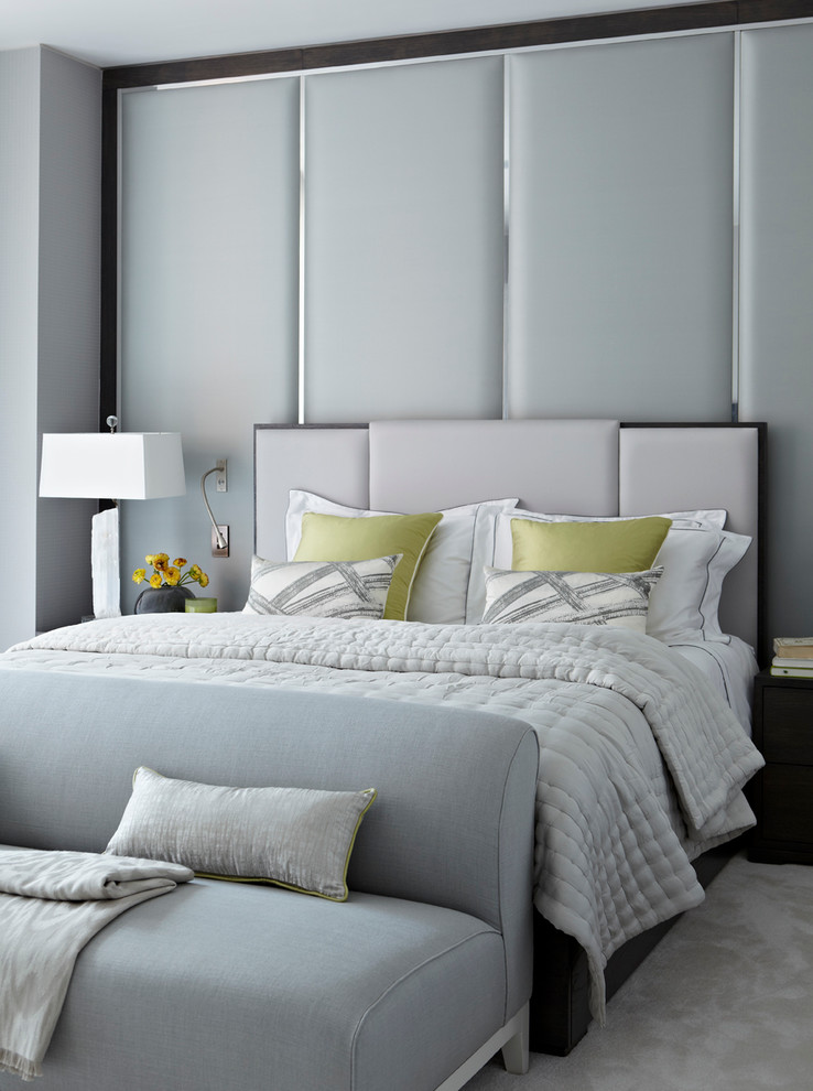 Photo of a contemporary grey and silver bedroom in London.