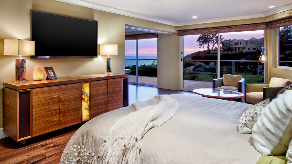 Bedroom - huge eclectic master medium tone wood floor and brown floor bedroom idea in Orange County with multicolored walls