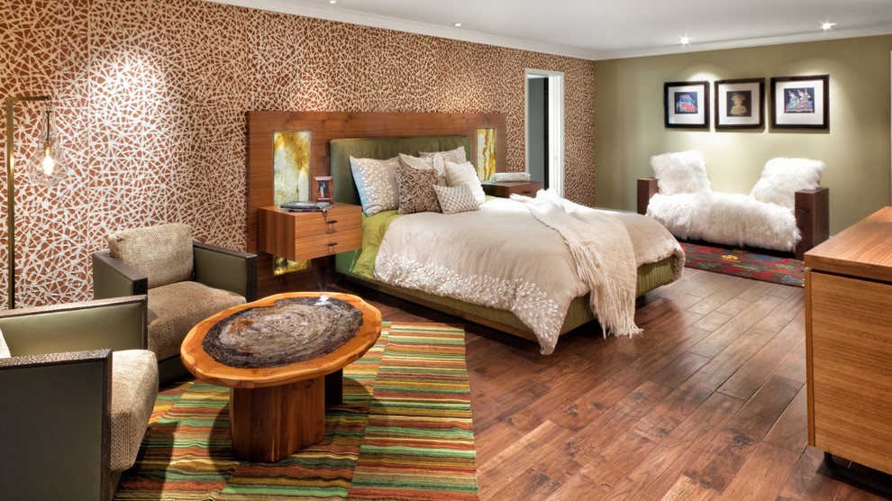 Inspiration for a huge eclectic master medium tone wood floor and brown floor bedroom remodel in Orange County with multicolored walls
