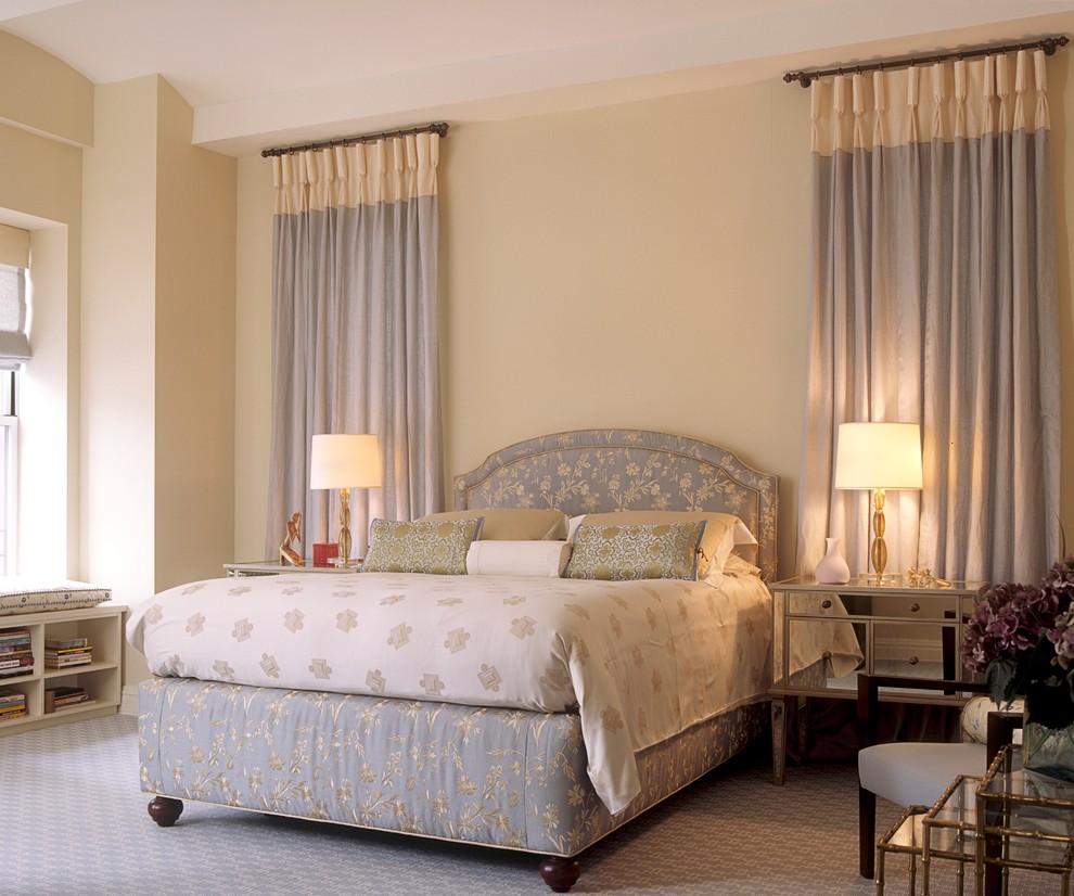 Example of a large transitional master carpeted bedroom design in New York with gray walls