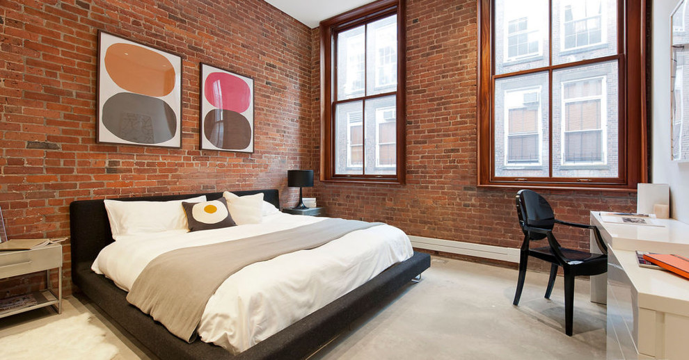 Bedroom - industrial concrete floor and gray floor bedroom idea in New York with no fireplace