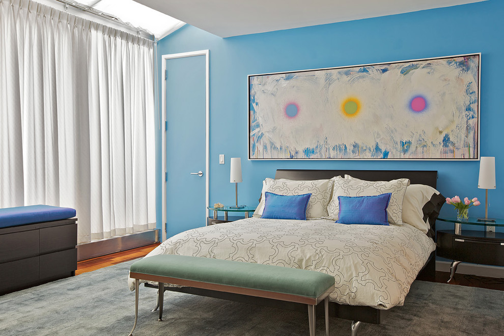 Inspiration for a contemporary bedroom remodel in New York with blue walls