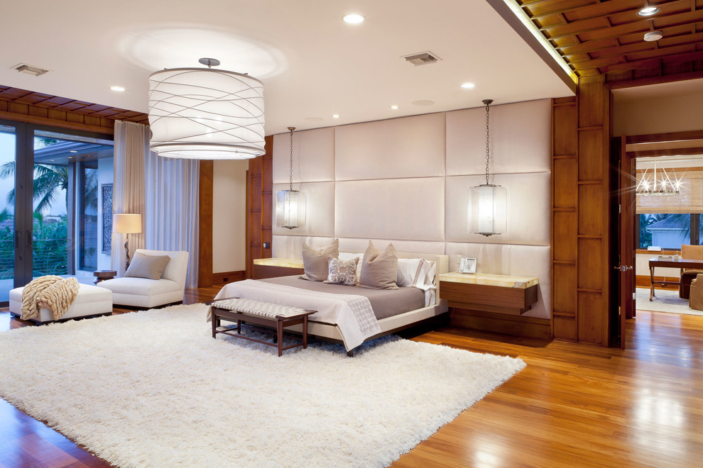 Photo of a world-inspired master bedroom in Other with medium hardwood flooring.