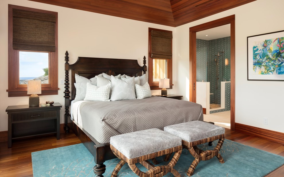 Island style medium tone wood floor and brown floor bedroom photo in Hawaii with white walls