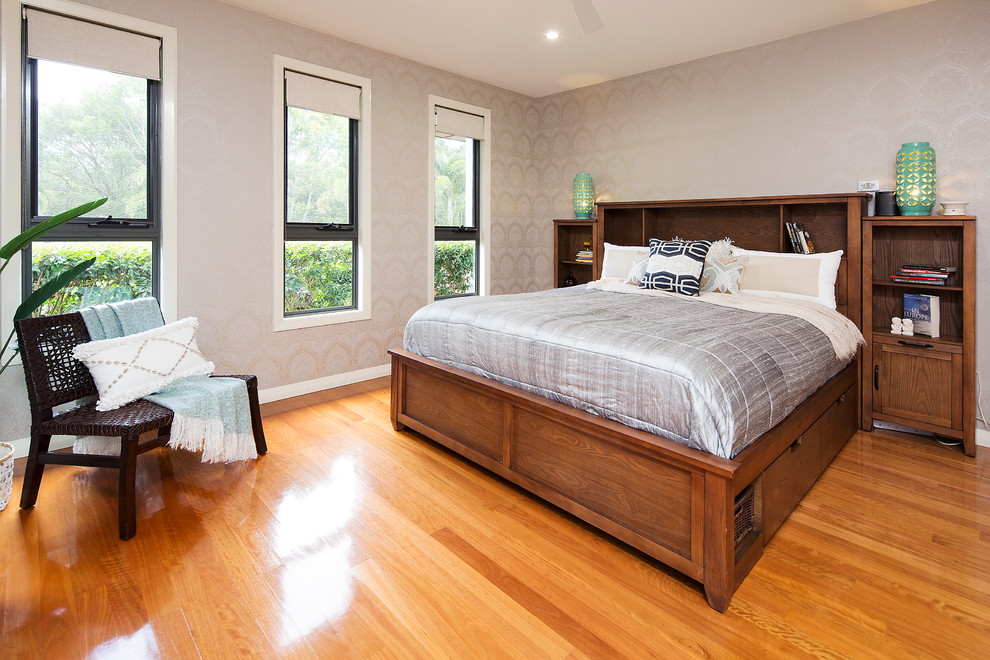 Bedroom - large tropical master medium tone wood floor bedroom idea in Gold Coast - Tweed with multicolored walls and no fireplace