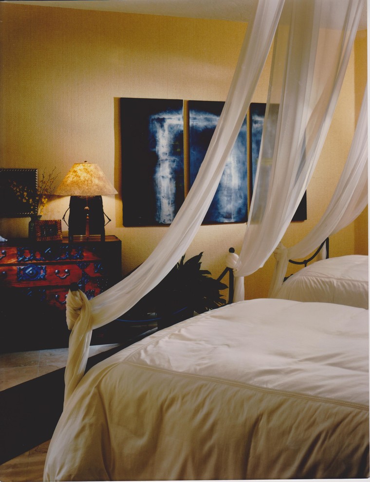 This is an example of a world-inspired bedroom in Tampa.
