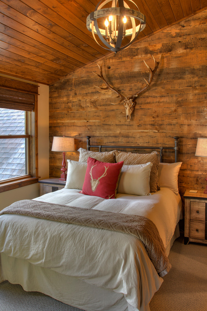 Medium sized rustic guest bedroom in Minneapolis with beige walls, carpet and beige floors.
