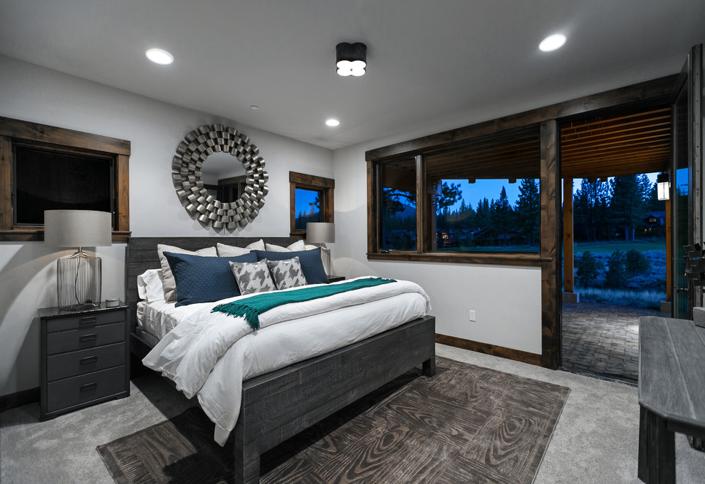 Inspiration for a large rustic master carpeted bedroom remodel in Sacramento with white walls and no fireplace