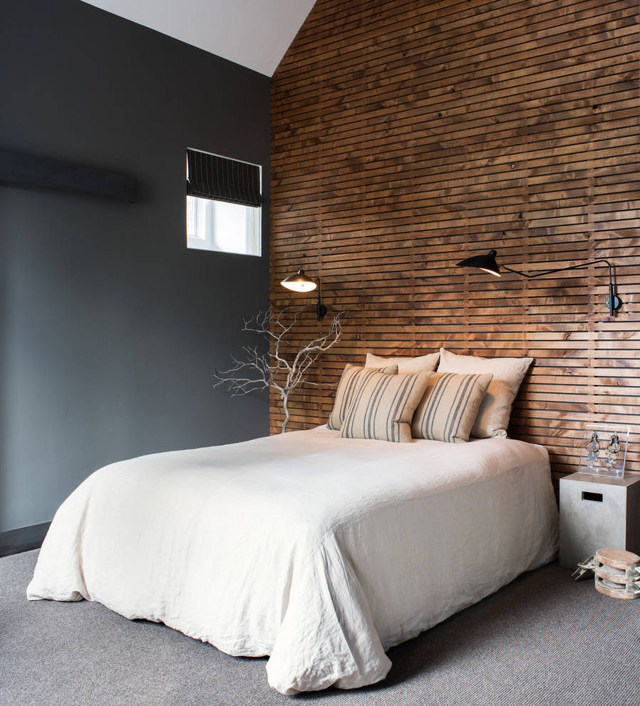 Bedroom - mid-sized industrial guest carpeted bedroom idea in Sacramento with no fireplace and black walls