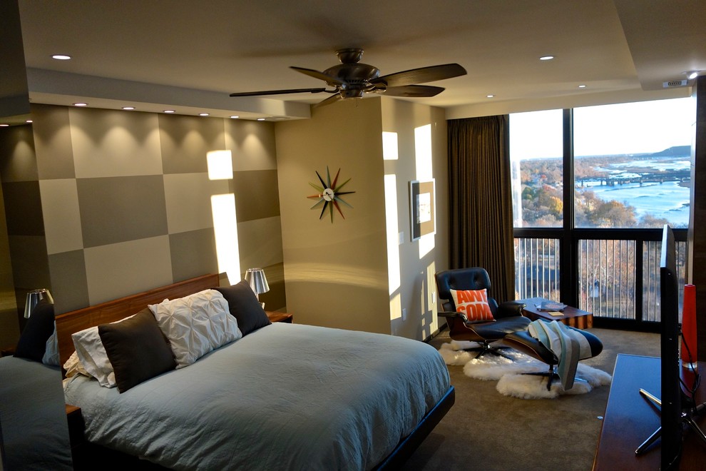 Imagen de dormitorio principal minimalista de tamaño medio con paredes multicolor y moqueta