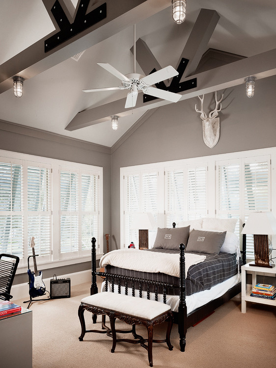 This is an example of a rural master bedroom in Houston with grey walls and carpet.