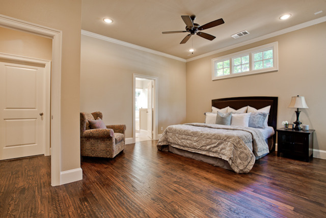 Example of a large transitional master dark wood floor bedroom design in Dallas with beige walls and no fireplace