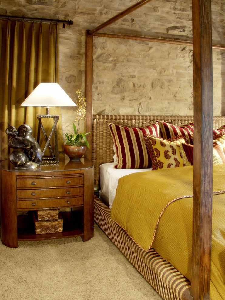Example of a tuscan carpeted bedroom design in Orange County