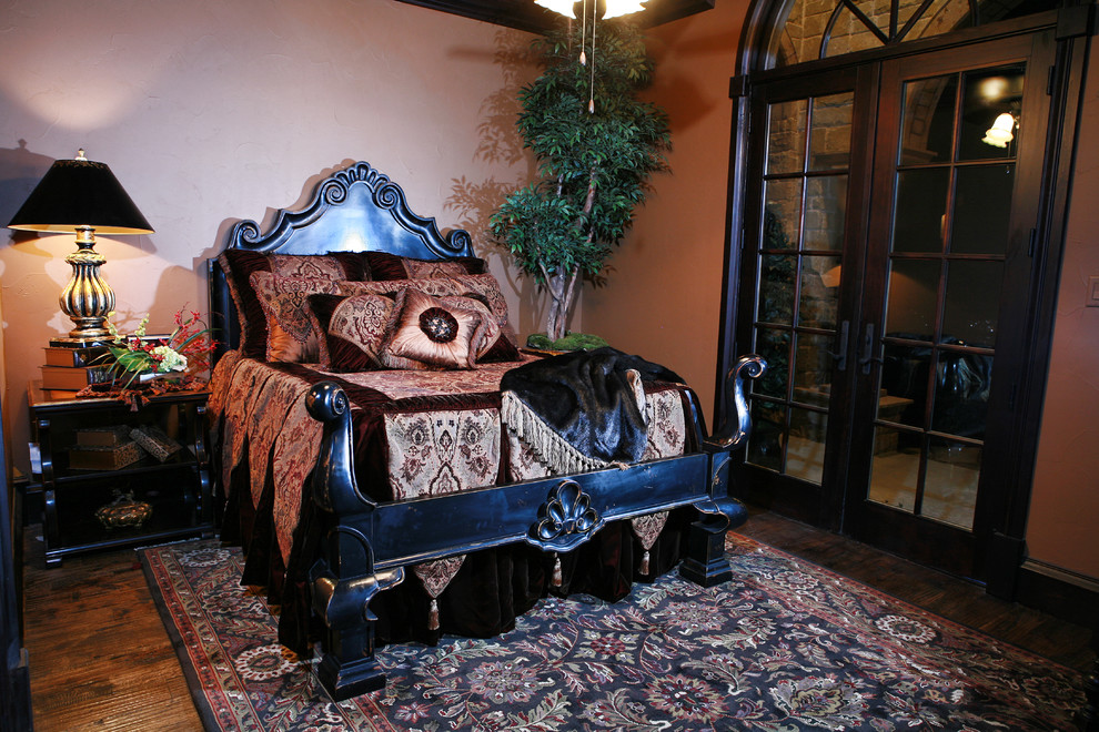 Huge elegant guest medium tone wood floor and brown floor bedroom photo in Dallas with brown walls