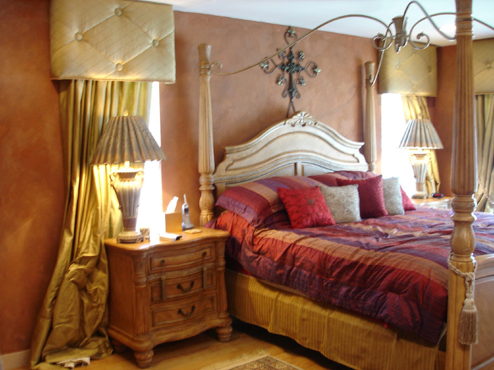 Example of a mid-sized southwest master light wood floor bedroom design in Albuquerque with brown walls