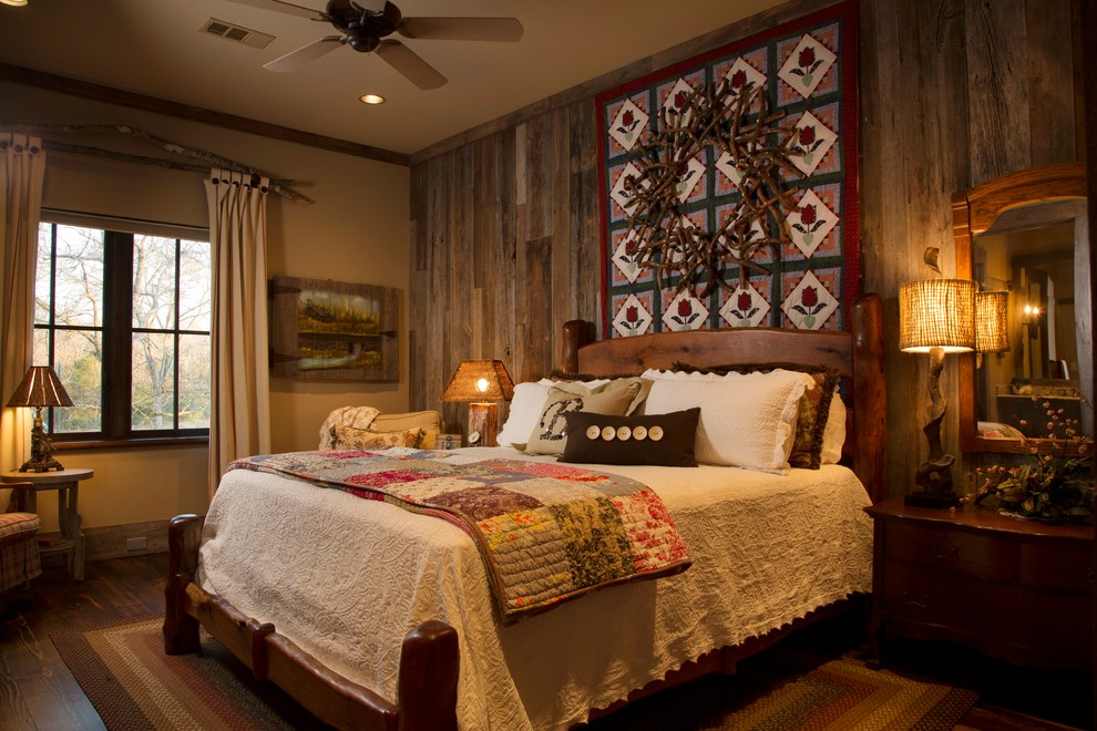 Rustic bedroom in Houston with beige walls and dark hardwood flooring.