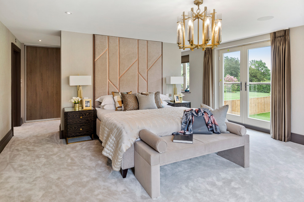 Inspiration for a contemporary master bedroom in London with carpet, beige walls and grey floors.