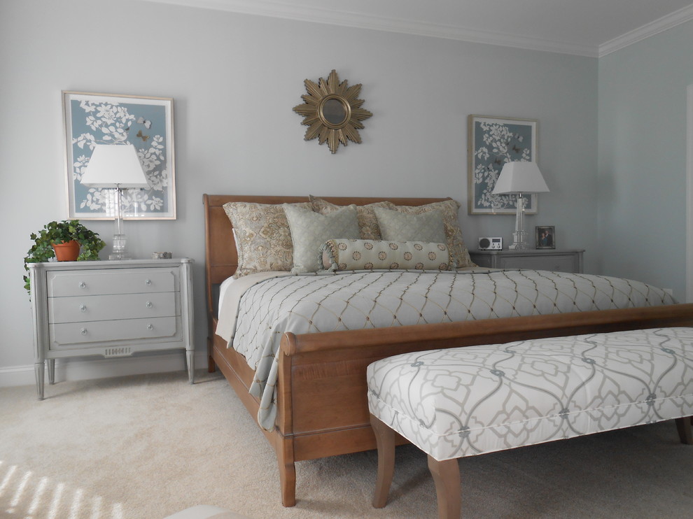 This is an example of a medium sized traditional master bedroom in Baltimore with blue walls, carpet, no fireplace and beige floors.